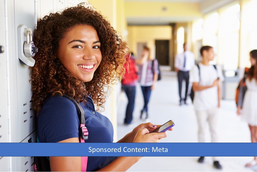 Teen girl on phone in school